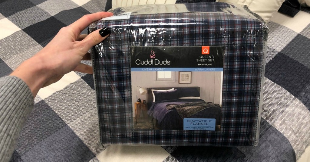 Navy Blue Cuddl Duds Flannel Sheets being held up at Kohl's
