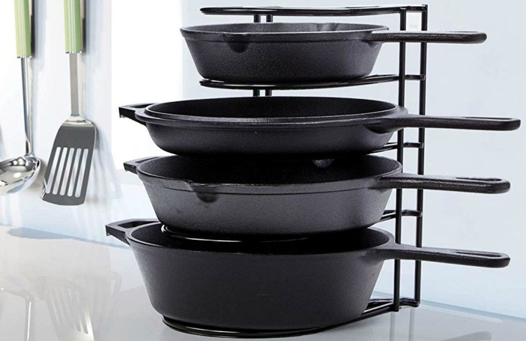 5-tier pan stand with four cast iron skillets
