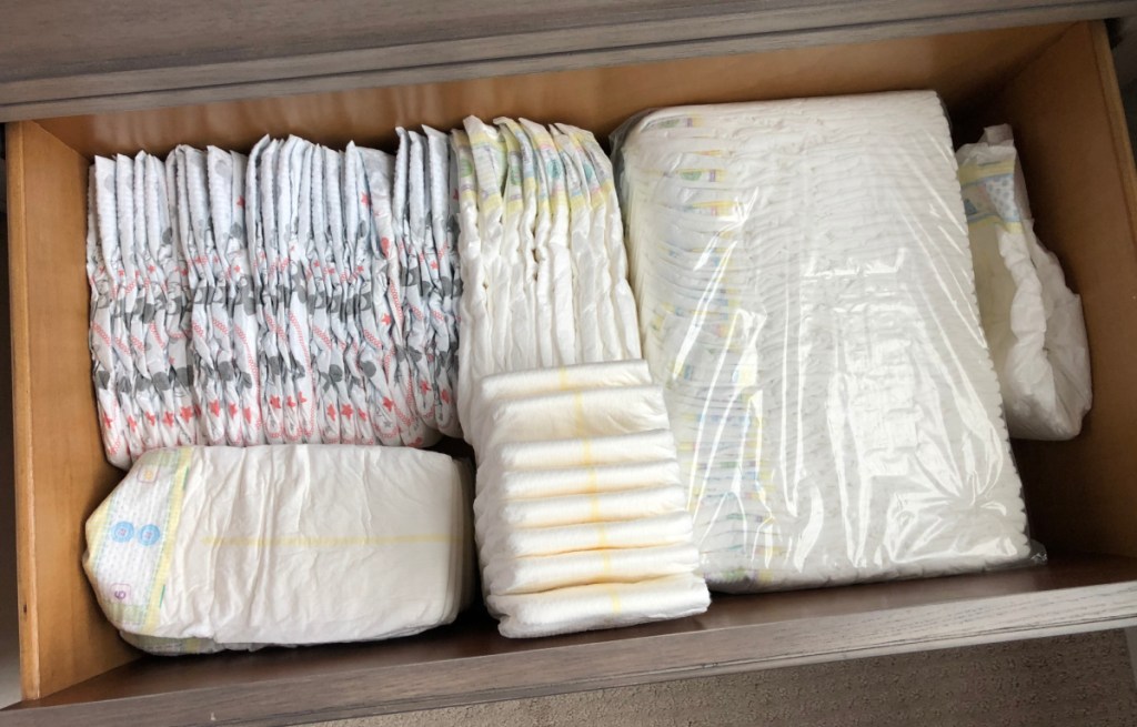 A drawer full of diapers