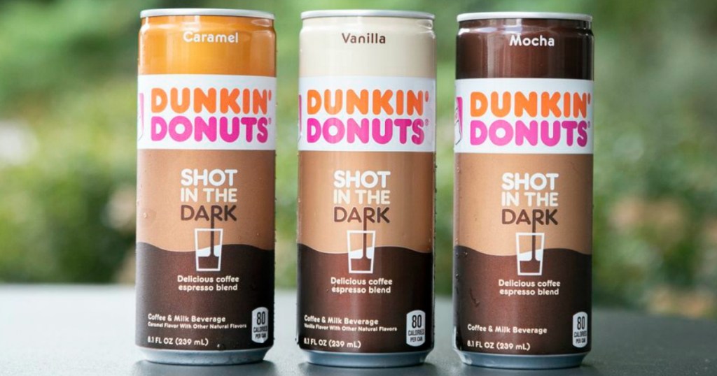 Dunkin Shot in the Dark coffee cans on table outside