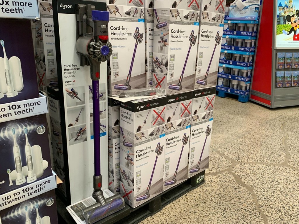 boxes with vacuum cleaners on display in store