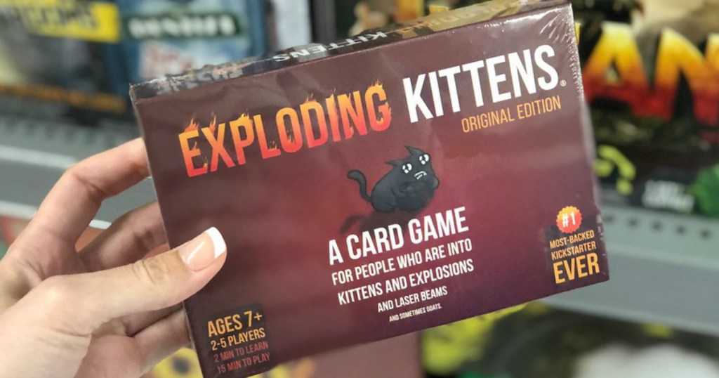 hand holding exploding kittens card game