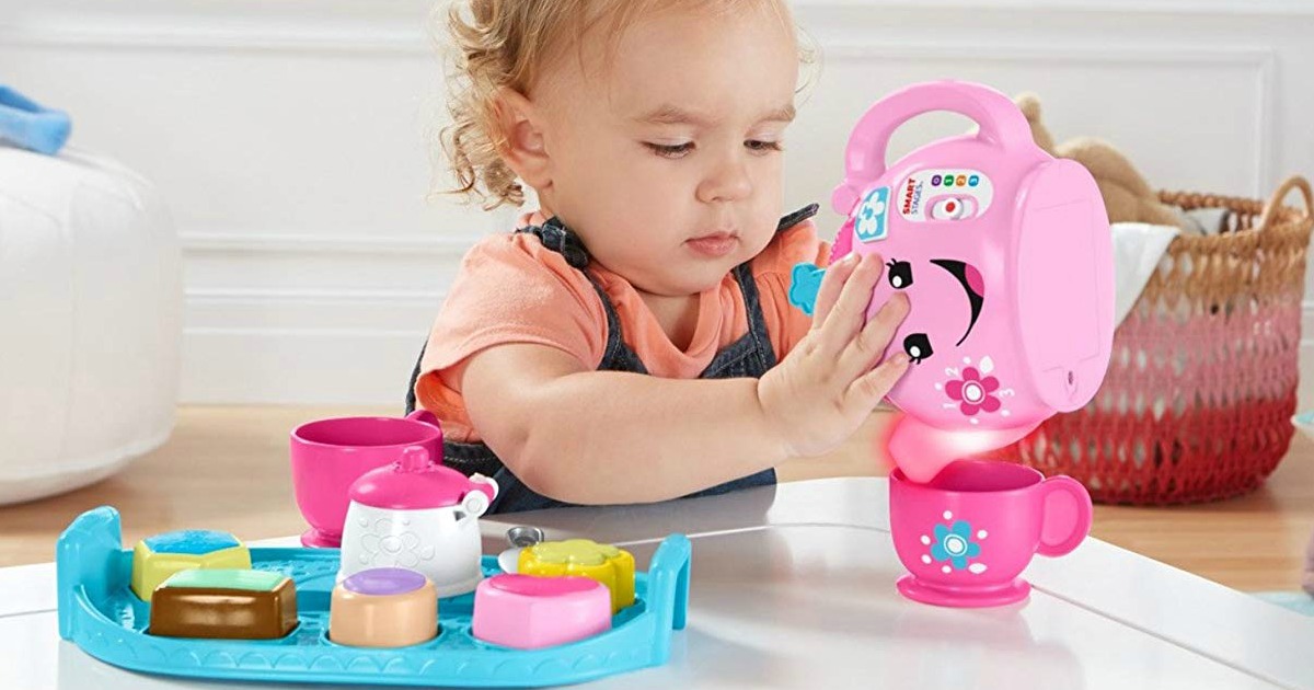 child playing with Fisher-Price Sweet Manners Tea Set