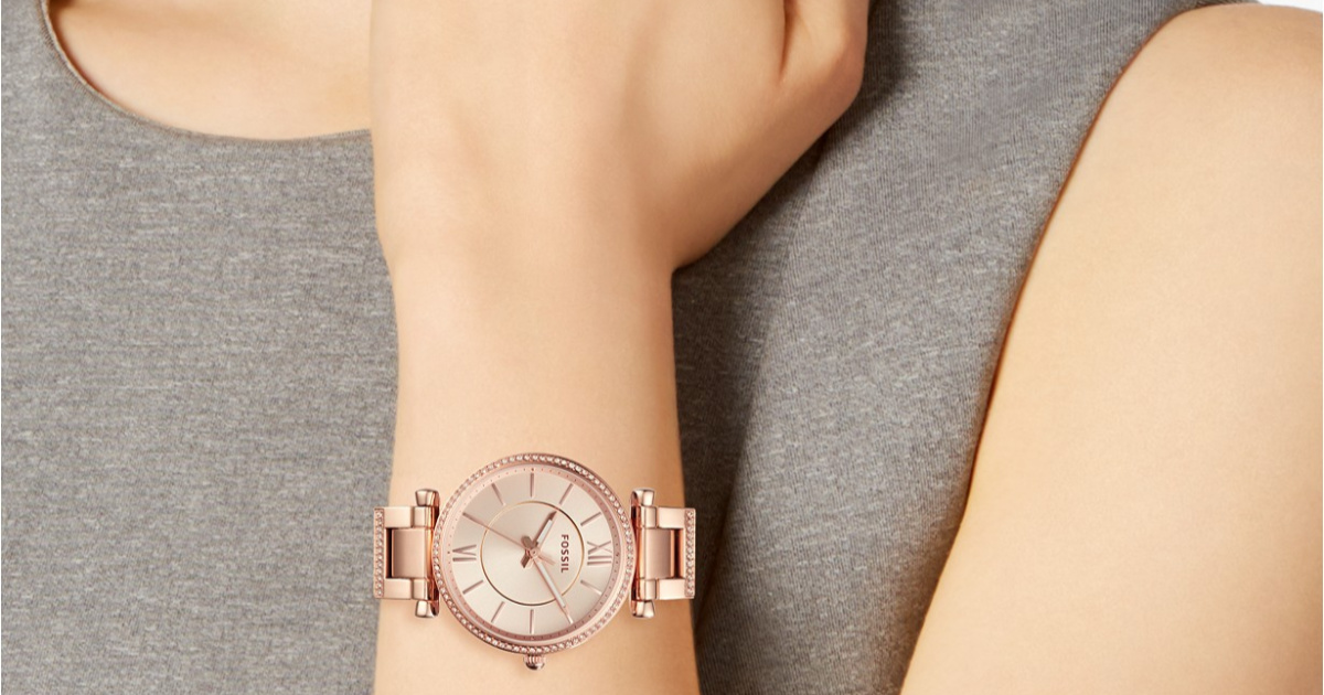 woman wearing a rose gold fossil watch