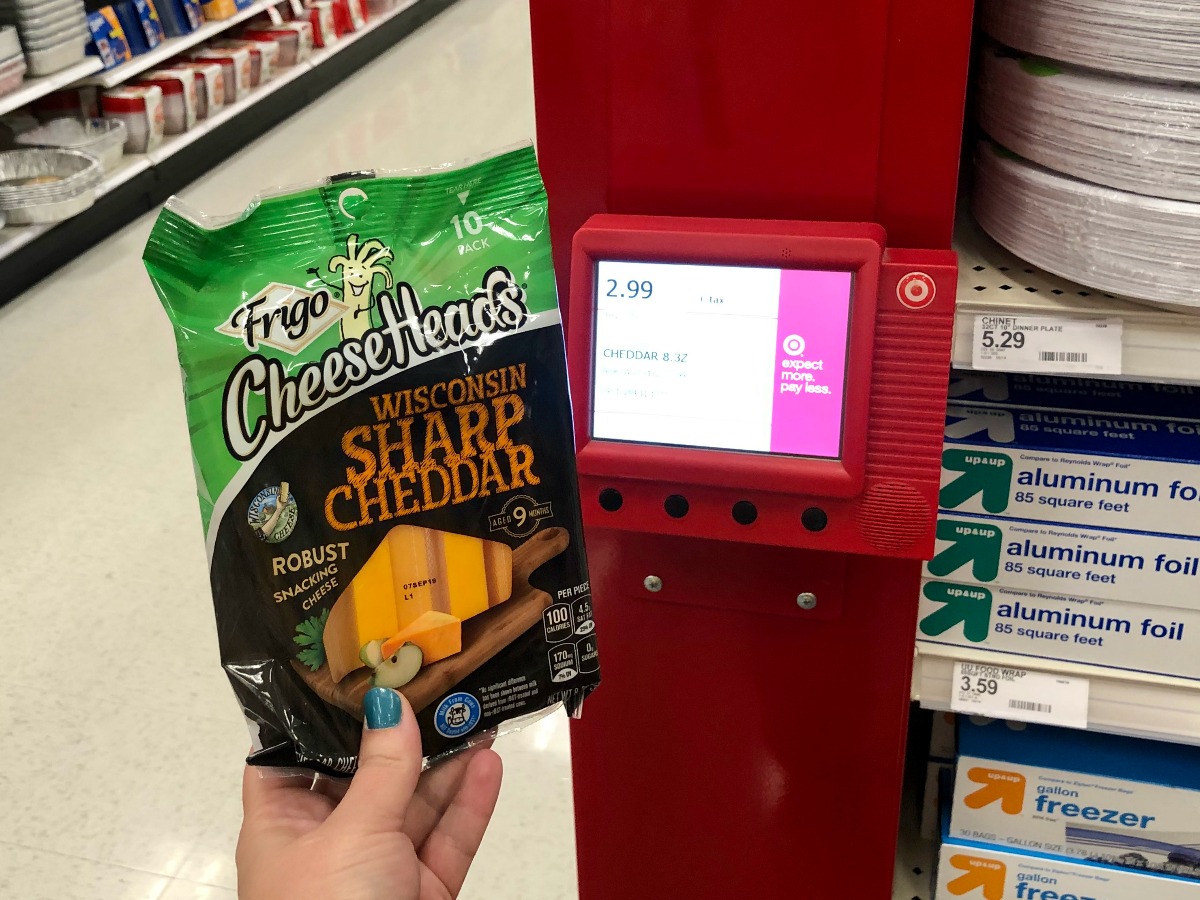 frigo cheeseheads wisconsin sharp cheddar cheese sticks being held by Target kiosk