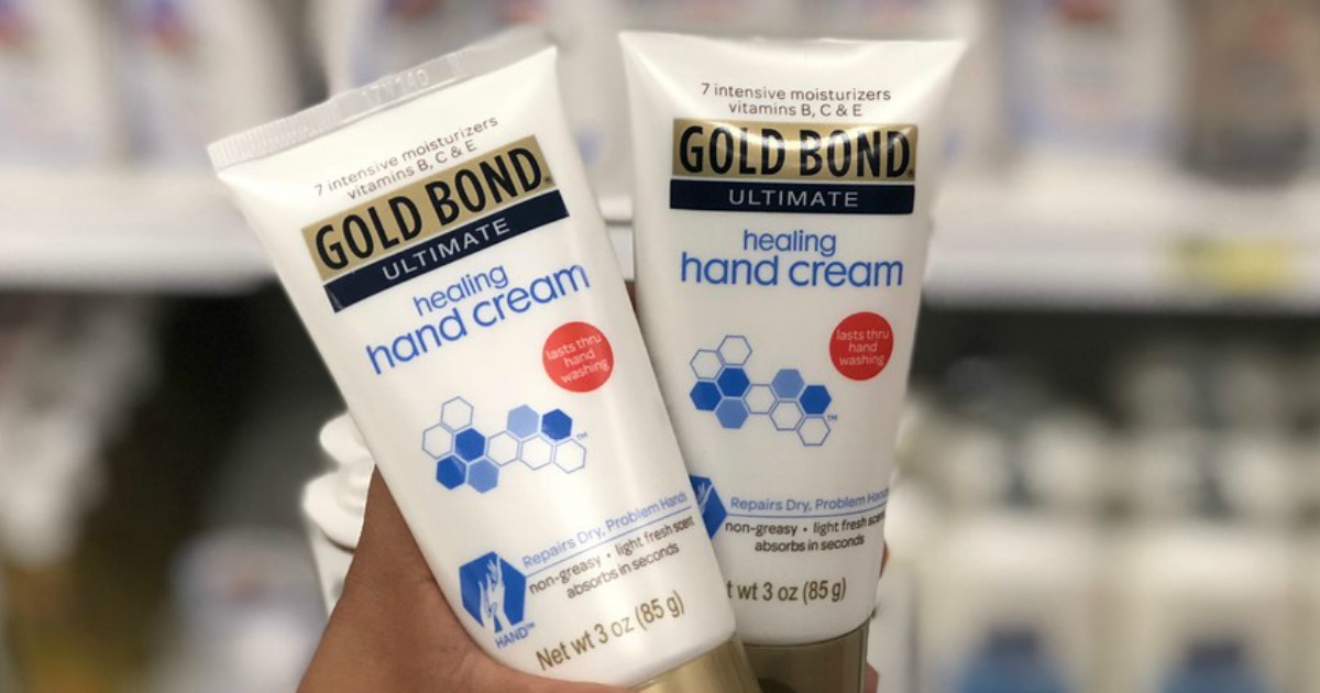 Two Gold Bond Healing Hand Creams being held