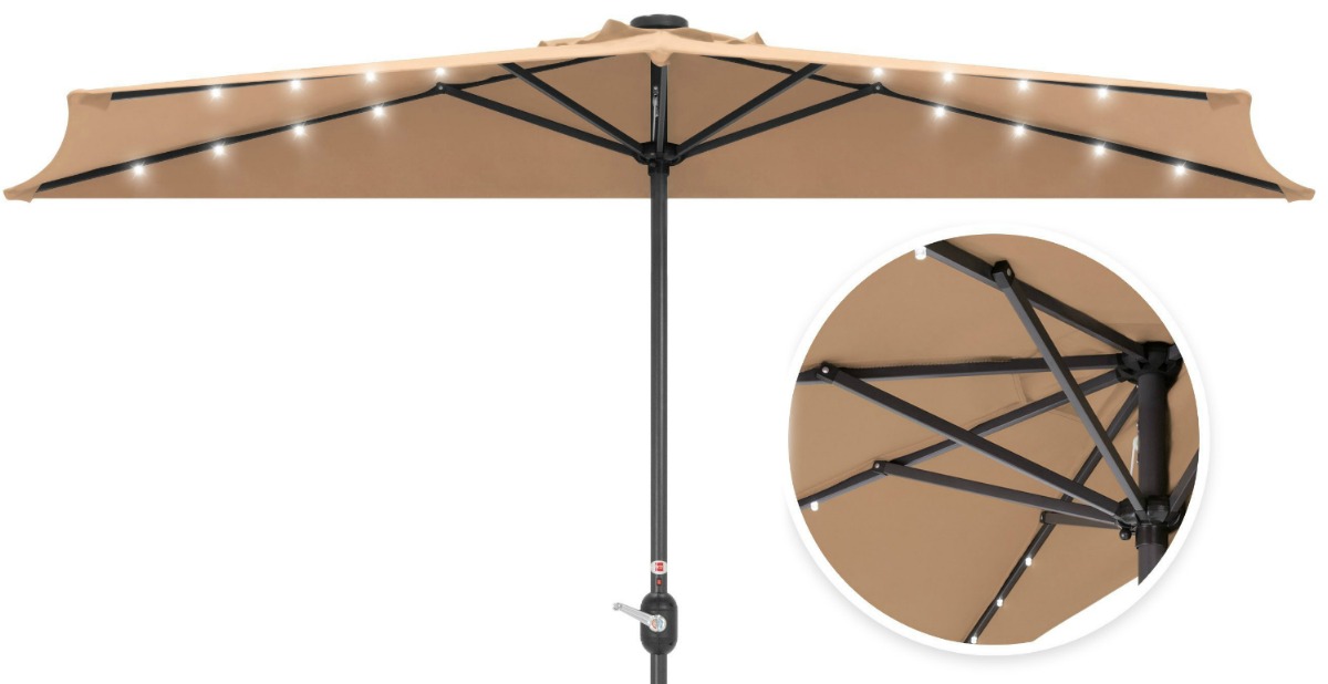 brown patio umbrella opened with LED lights lit up