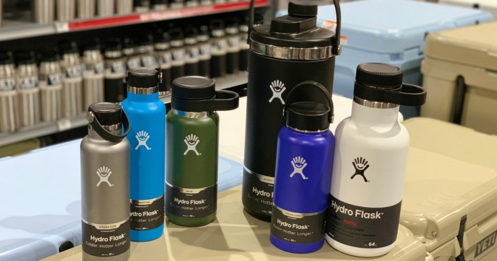 Variety of Hydro Flask bottles arranged on cooler