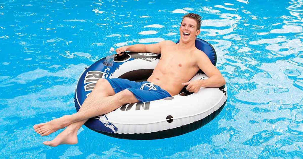 man in pool on intex river run blue tube float