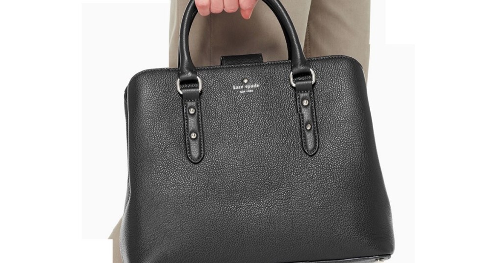 Kate Spade satchel being held by a woman