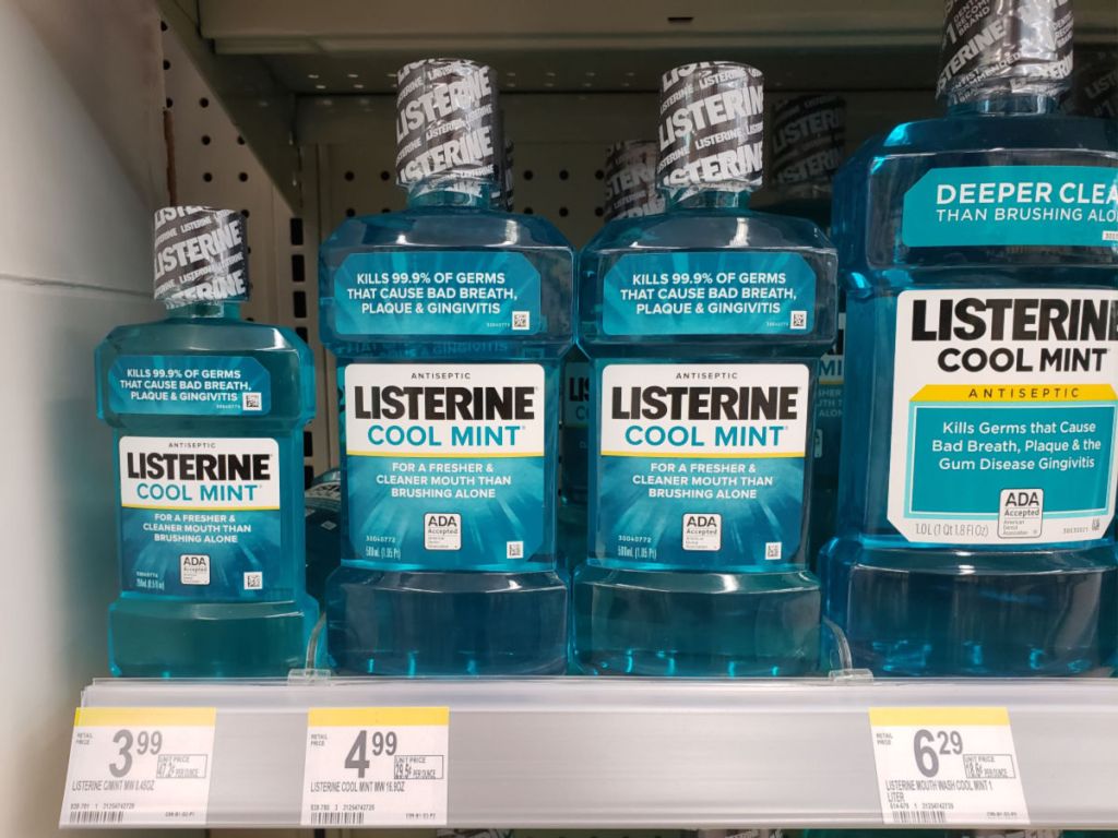 Listerine Mouth Wash 8.45 ounce, 16.9 oz, and 1 liter bottles on shelf in walgreens