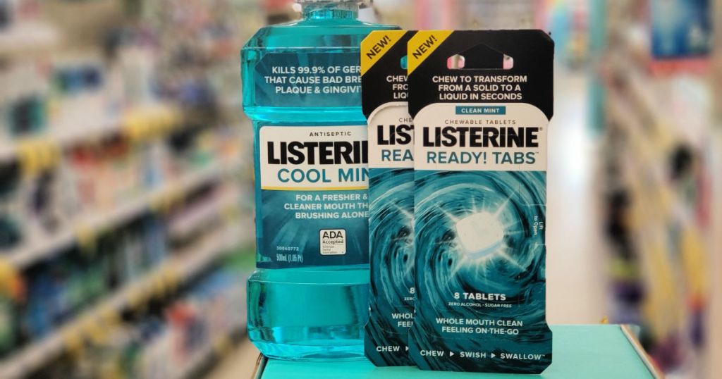 Two packs of Listerine Ready Tabs and Mouth Wash on blue counter inside walgreens