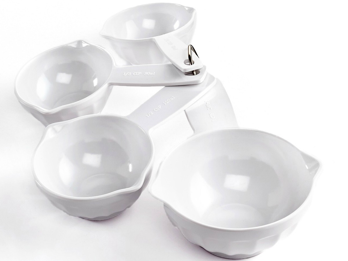 four white measuring cups