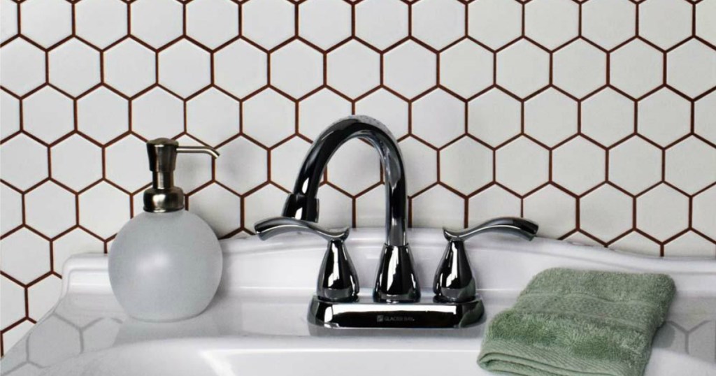 Hex tiles behind bathroom sink