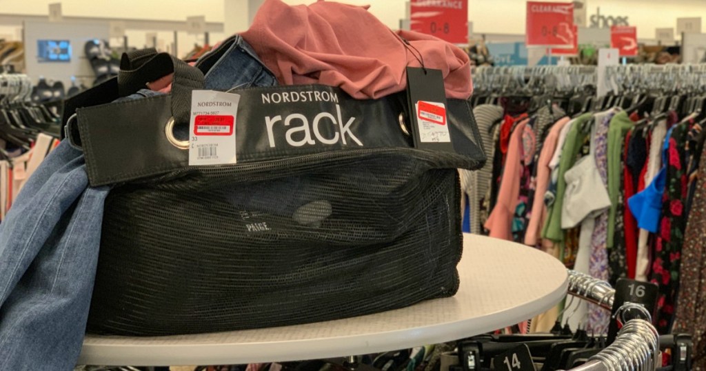 bag with clothes on rack