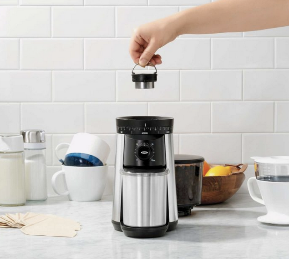 Person changing grind setting of OXO BREW Conical Burr Coffee Grinder