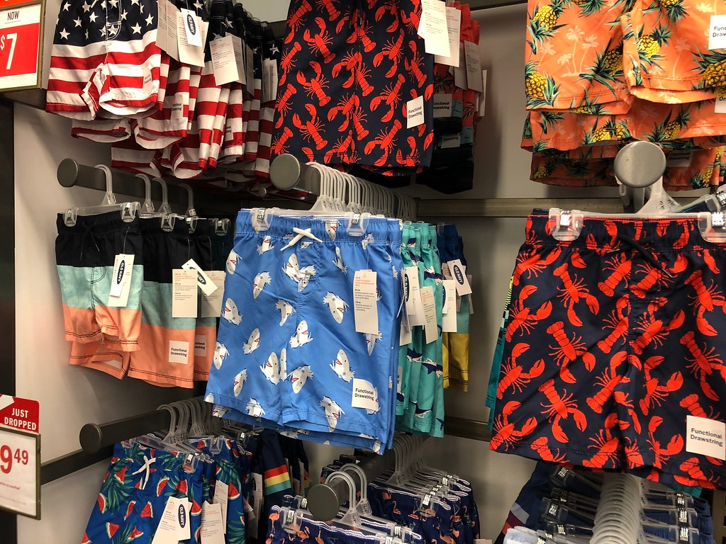 Old Navy Swim Trunks hanging up at the store