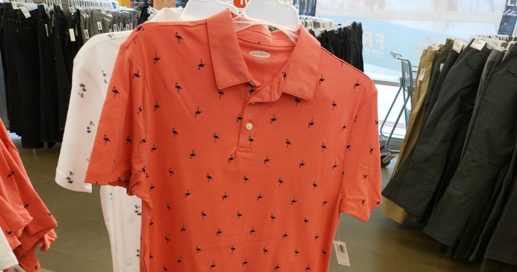Old Navy Flamingo Polo for Men hanging inside Old Navy store