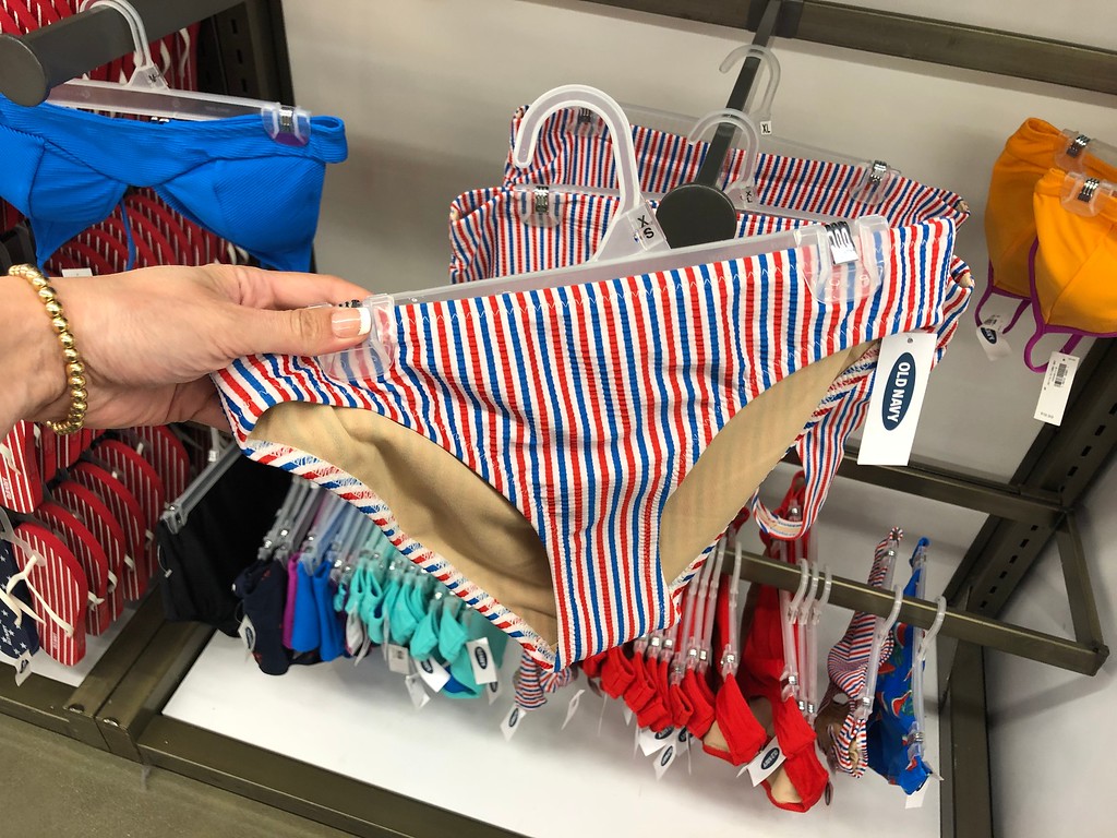 Old Navy Women's Swim Bottoms being held by a woman's hand