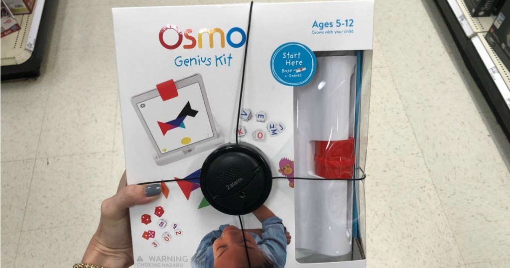 woman's hand holding Osmo Genius Kit