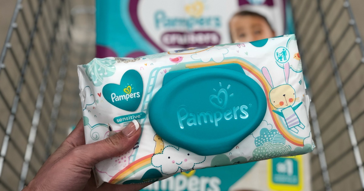 Woman holding Pampers Sensitive Wipes at Walgreens