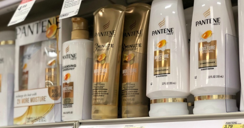 white and gold shampoo bottles on shelf 