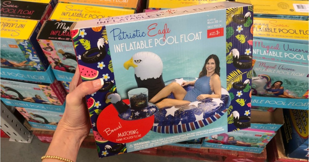 Woman holding box containing Patriotic Eagle Pool Float at Sam's Club