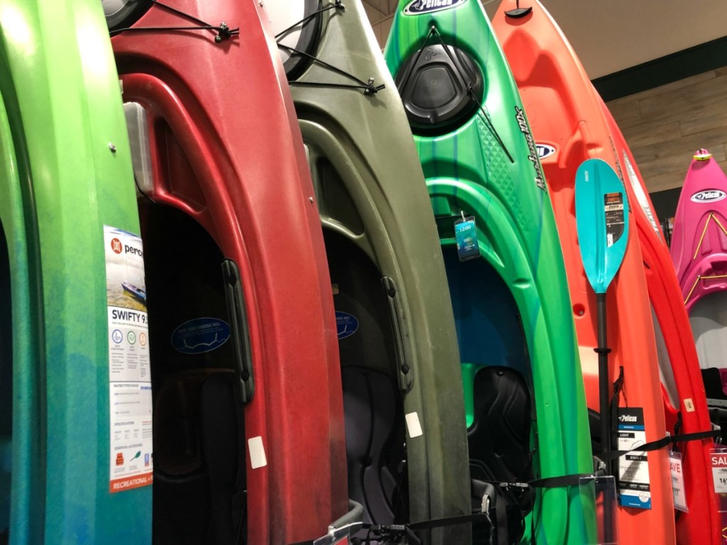 Various colored kayaks in store