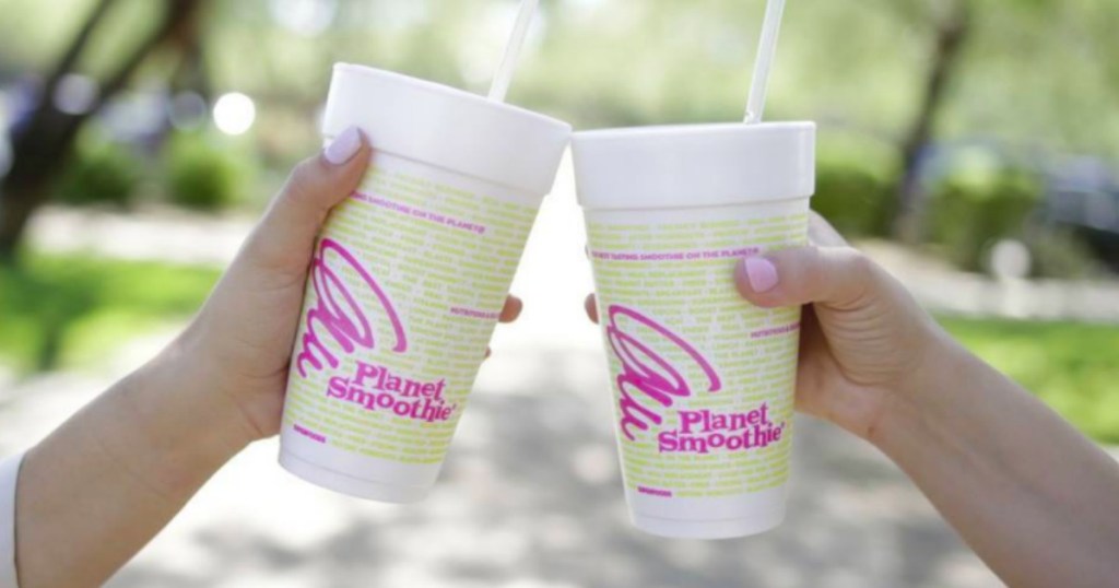 two hands cheersing with planet smoothie cups