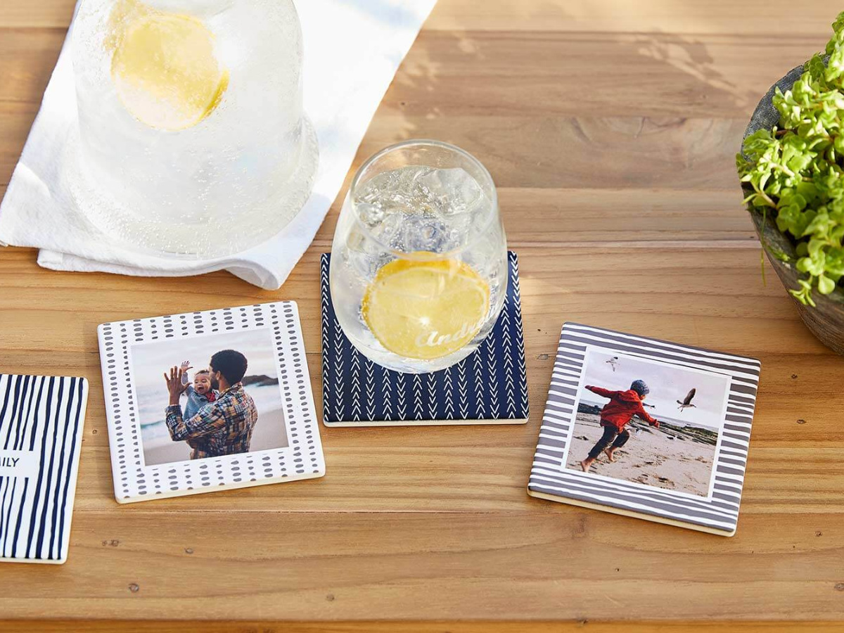 Shutterfly coasters of families and glass of water with lemon