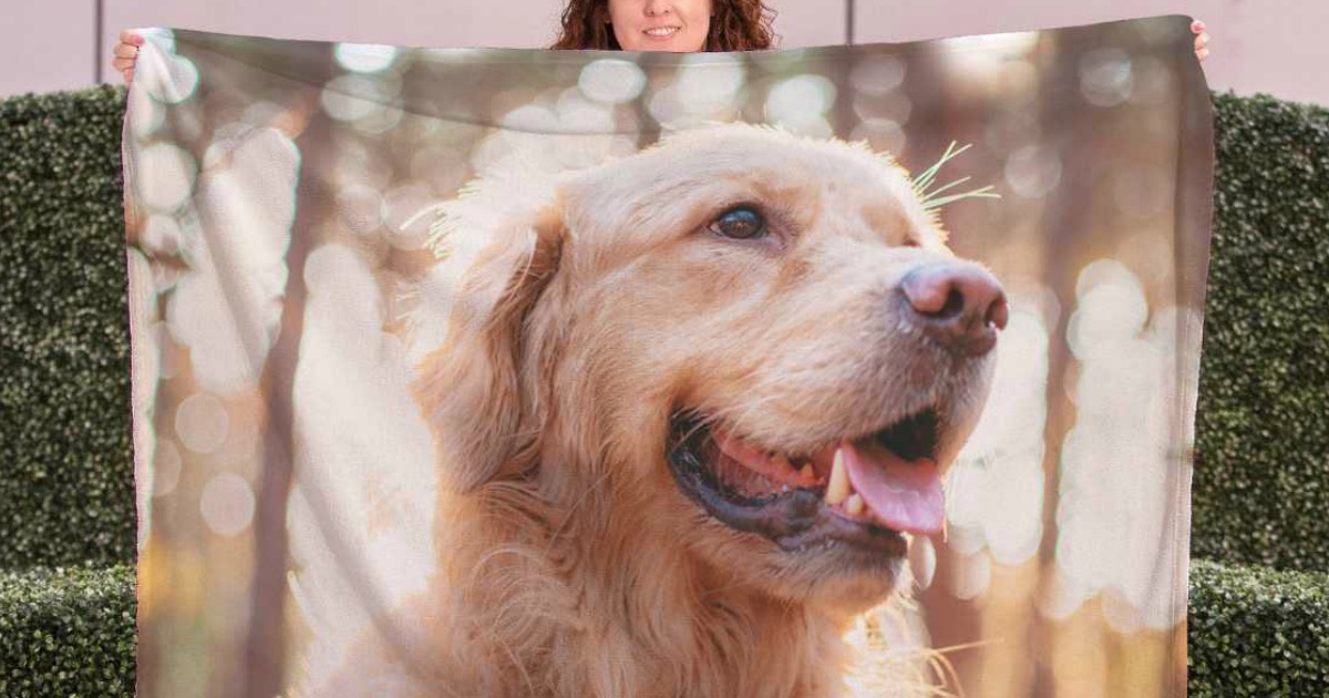 Large fleece photo blanket of a dog being held up by a woman