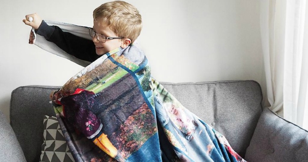 Young boy wrapped in a personalized photo blanket