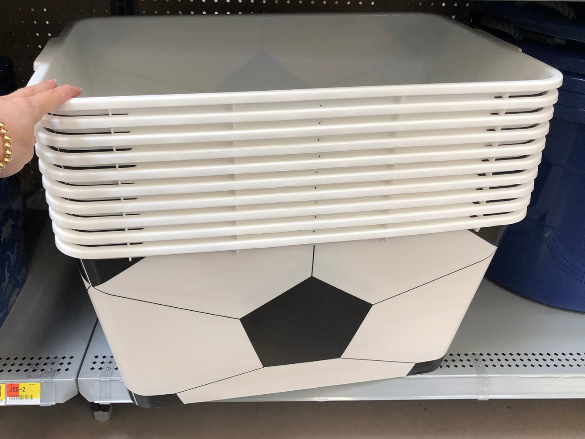 black and white plastic totes with soccer ball pattern on a store shelf