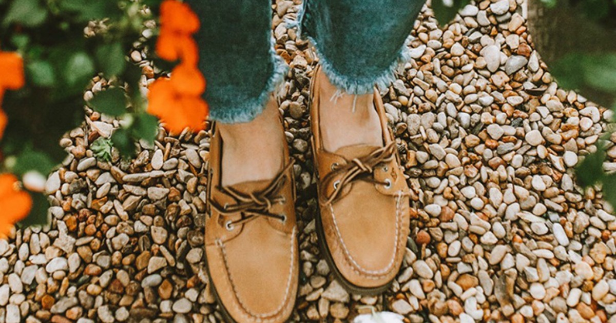 tan boat shoes on woman in garden