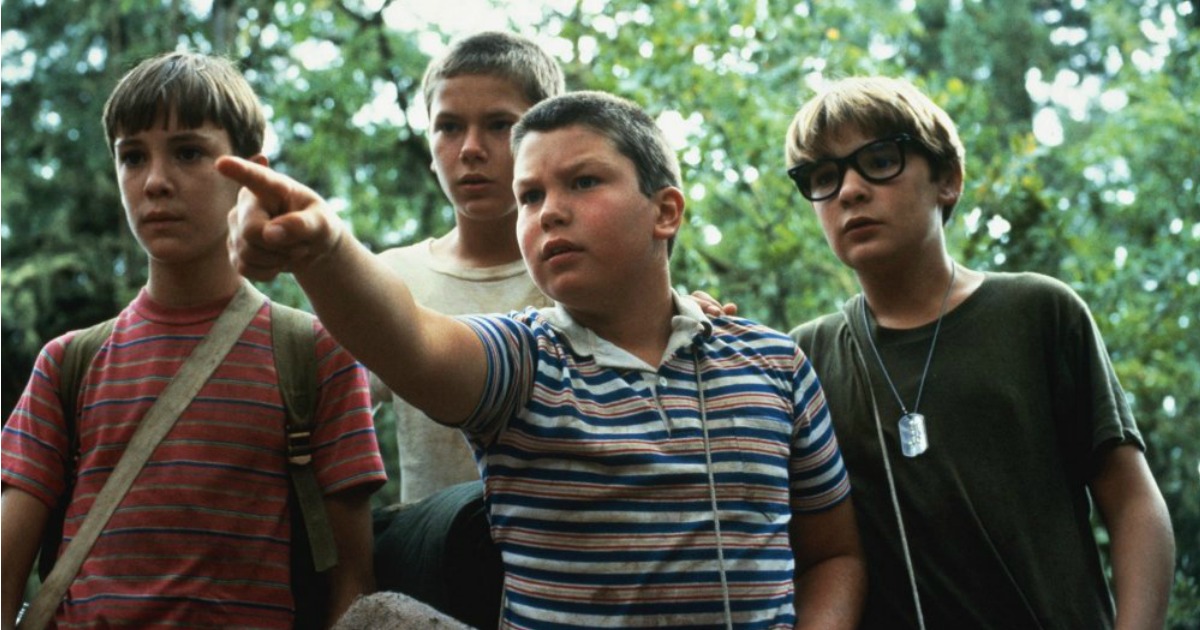 movie still from Stand By Me showing four boys, one of them pointing