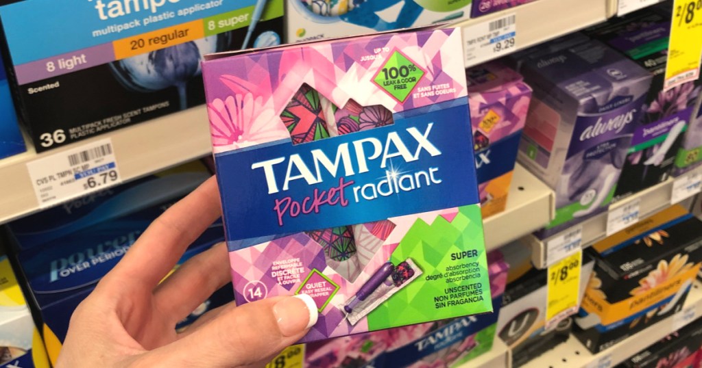 Woman's hand holding Tampax Pocket Radiant tampons