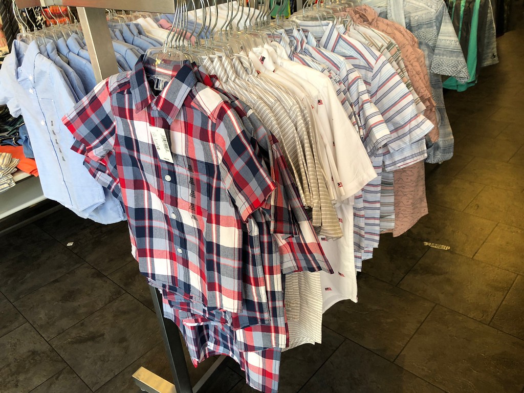 Boys Button Down Shirts hanging on a rack