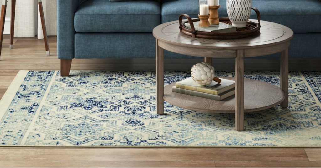 blue and cream geometric area rug in living room
