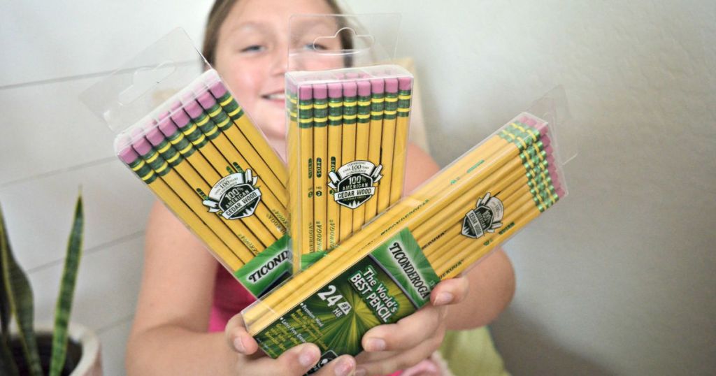 girl holding boxes of ticonderoga pencils