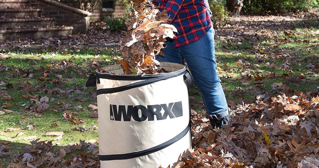 Woman dumping leaves into WORX collapsible yard bag