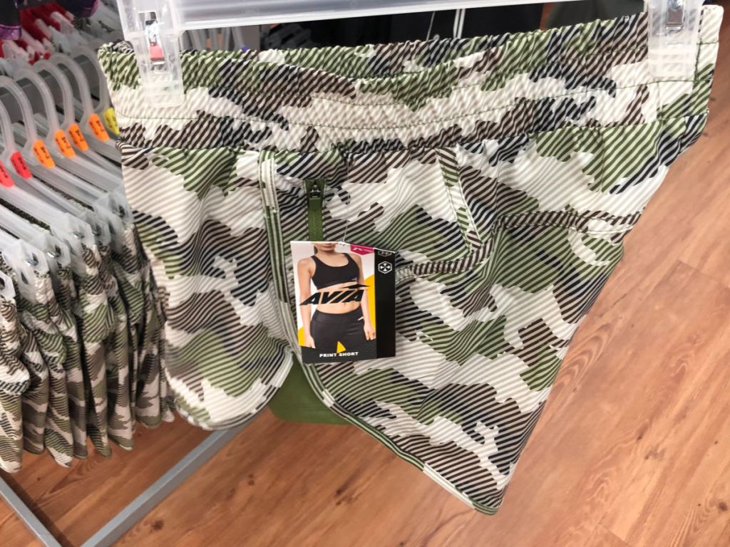 Walmart Camo Avia shorts being held up in store