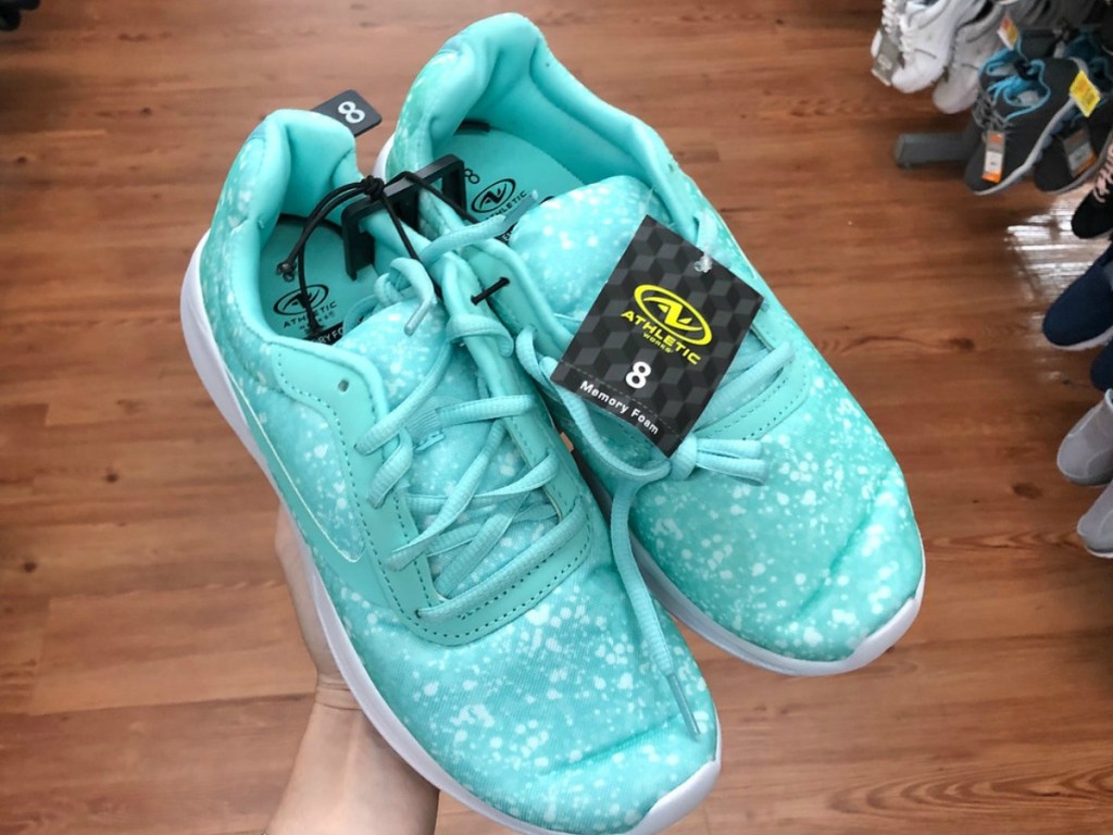 pair of women's aqua colored shoes in the store