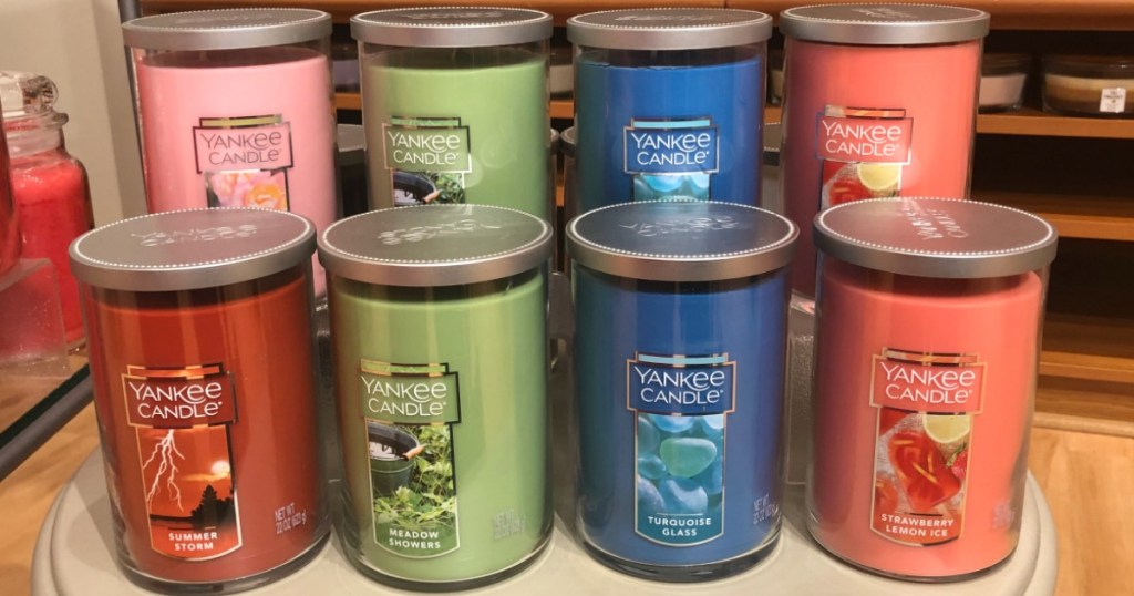 Eight Yankee Candle Large 2-Wick Candles sitting on a table