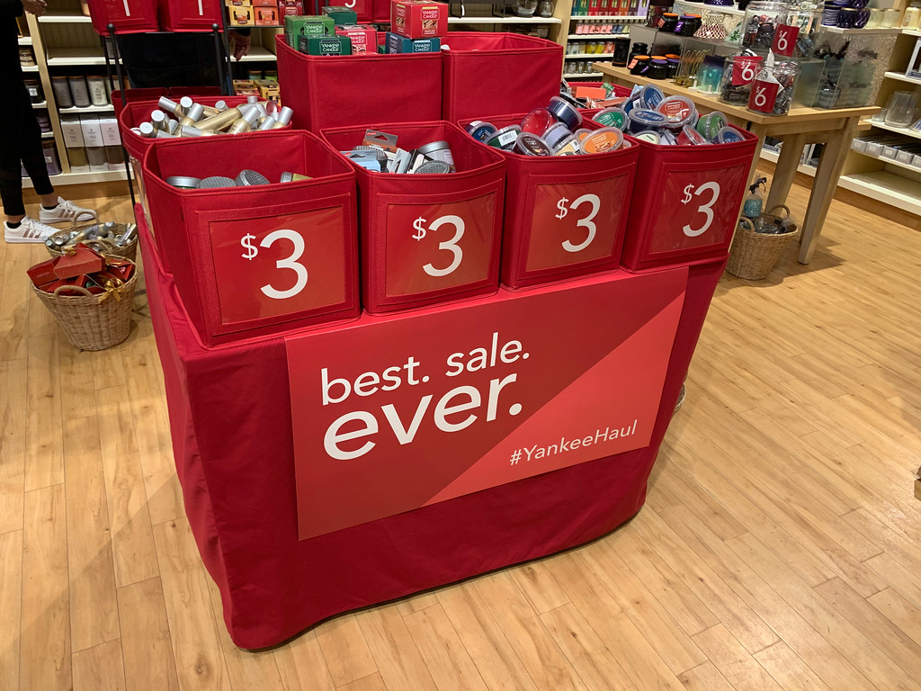 red bins of items on sale at Yankee Candle