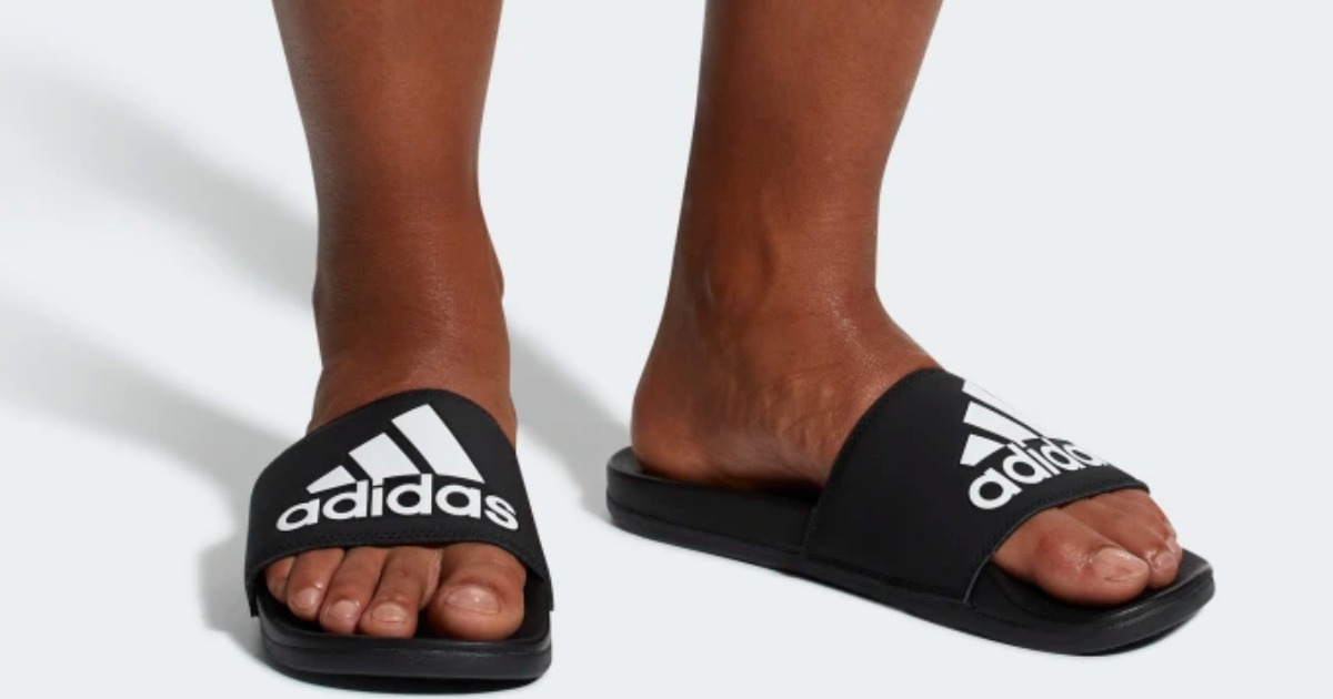 men's feet in adidas Adilette Cloudfoam Plus Logo Slides