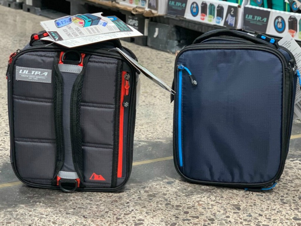 two lunch boxes near store display