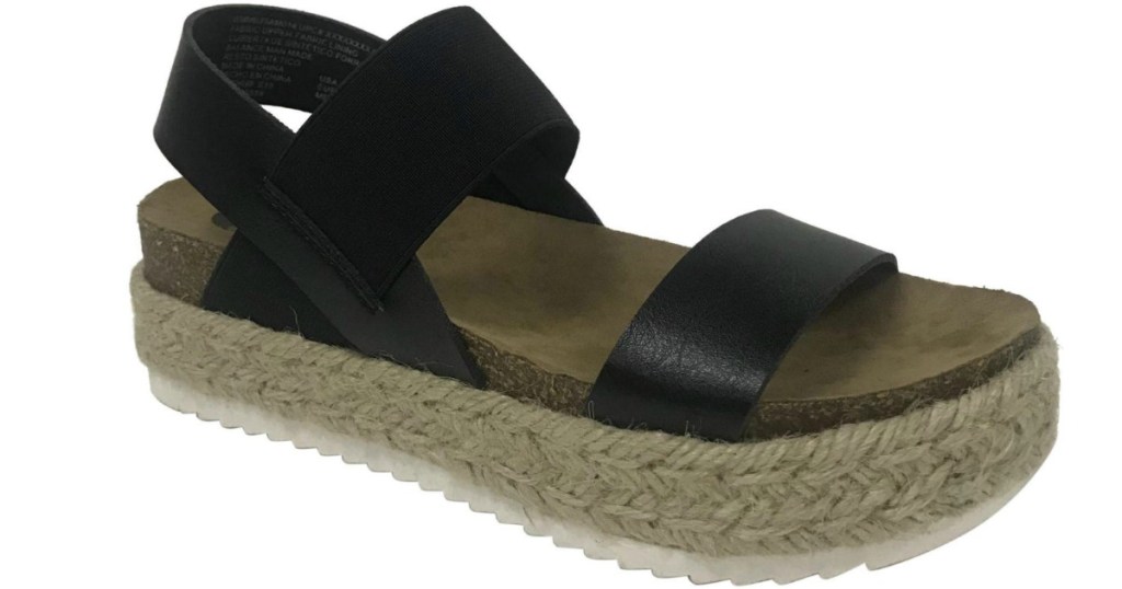 sandal with black straps and jute on the outer sole
