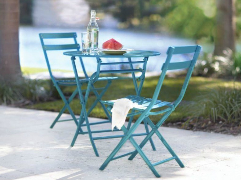 blue outdoor seating set by lake