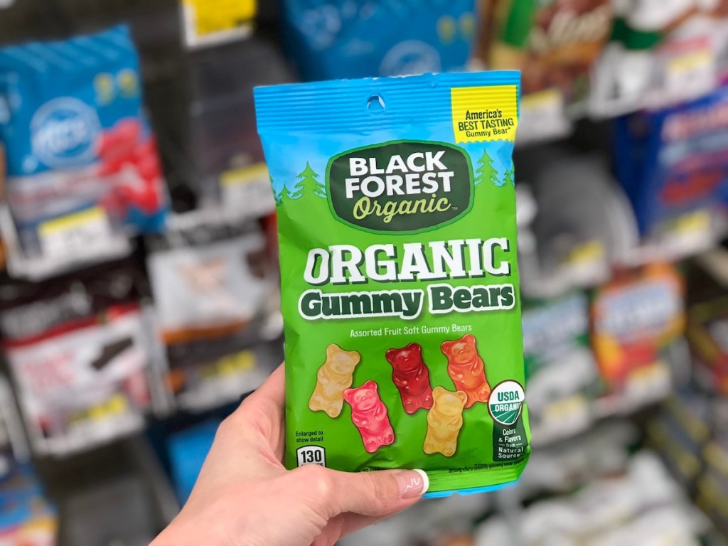 hand holding black forest organic gummy bears in store