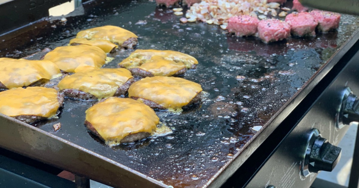 burgers with melted cheese on Blackstone griddle 